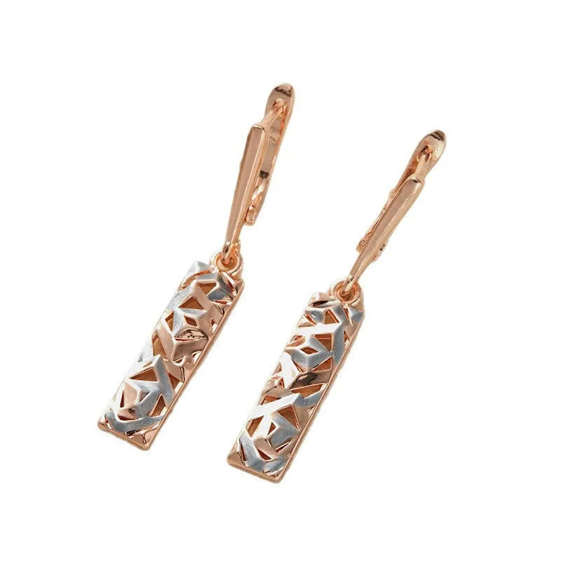 A pair of rectangular hollow stud earrings with a two-tone electroplated finish on a white background.