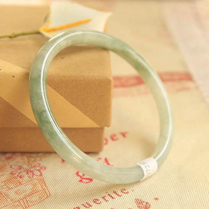 Green waxy jade geometric bracelet with Chinese-style design showing size measurement options