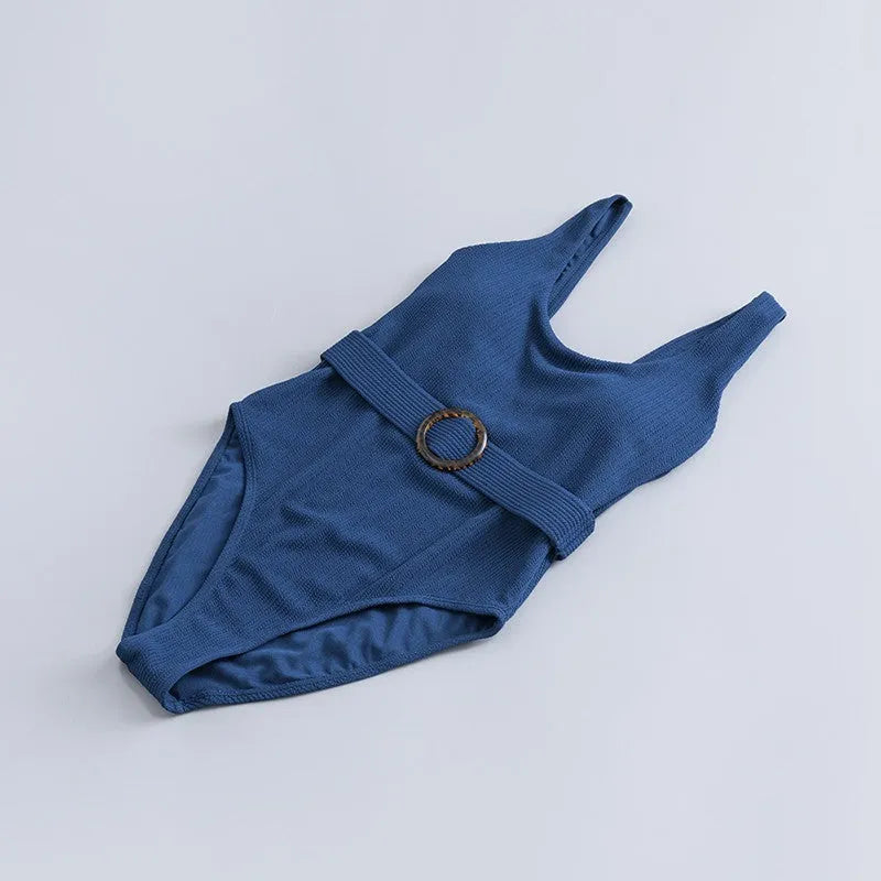 Navy blue women's one-piece slim swimsuit with triangle design and chest pad