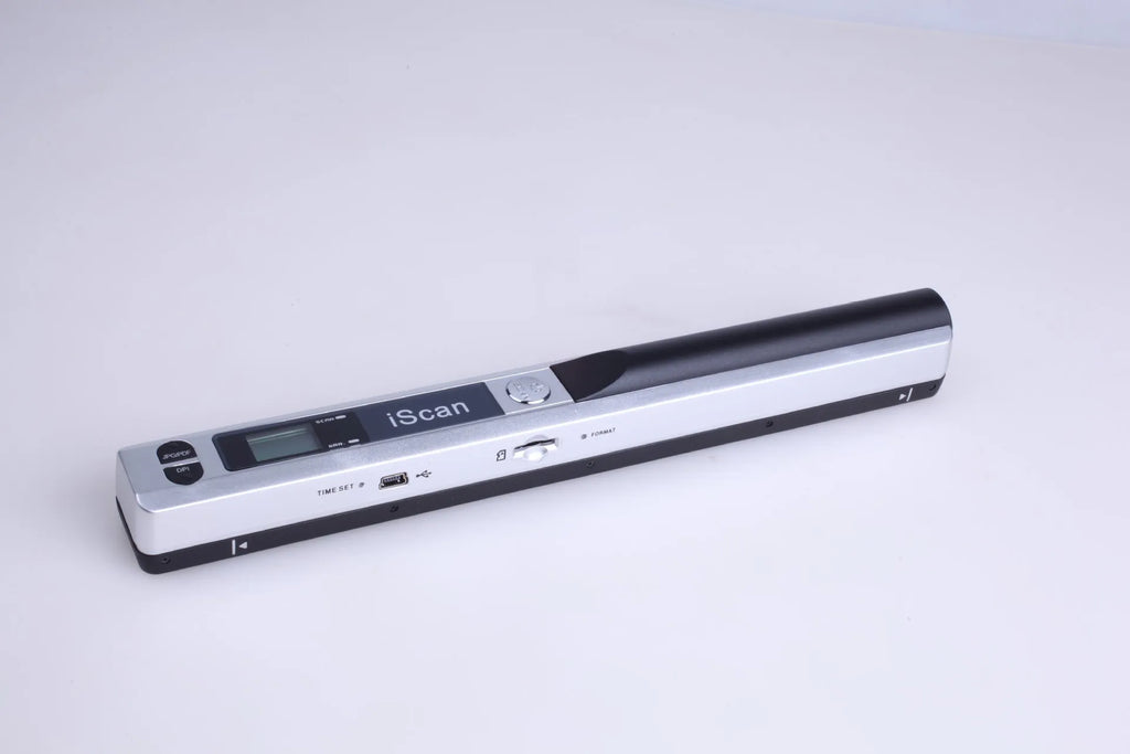 Plastic handheld USB document scanner on a desk next to papers.