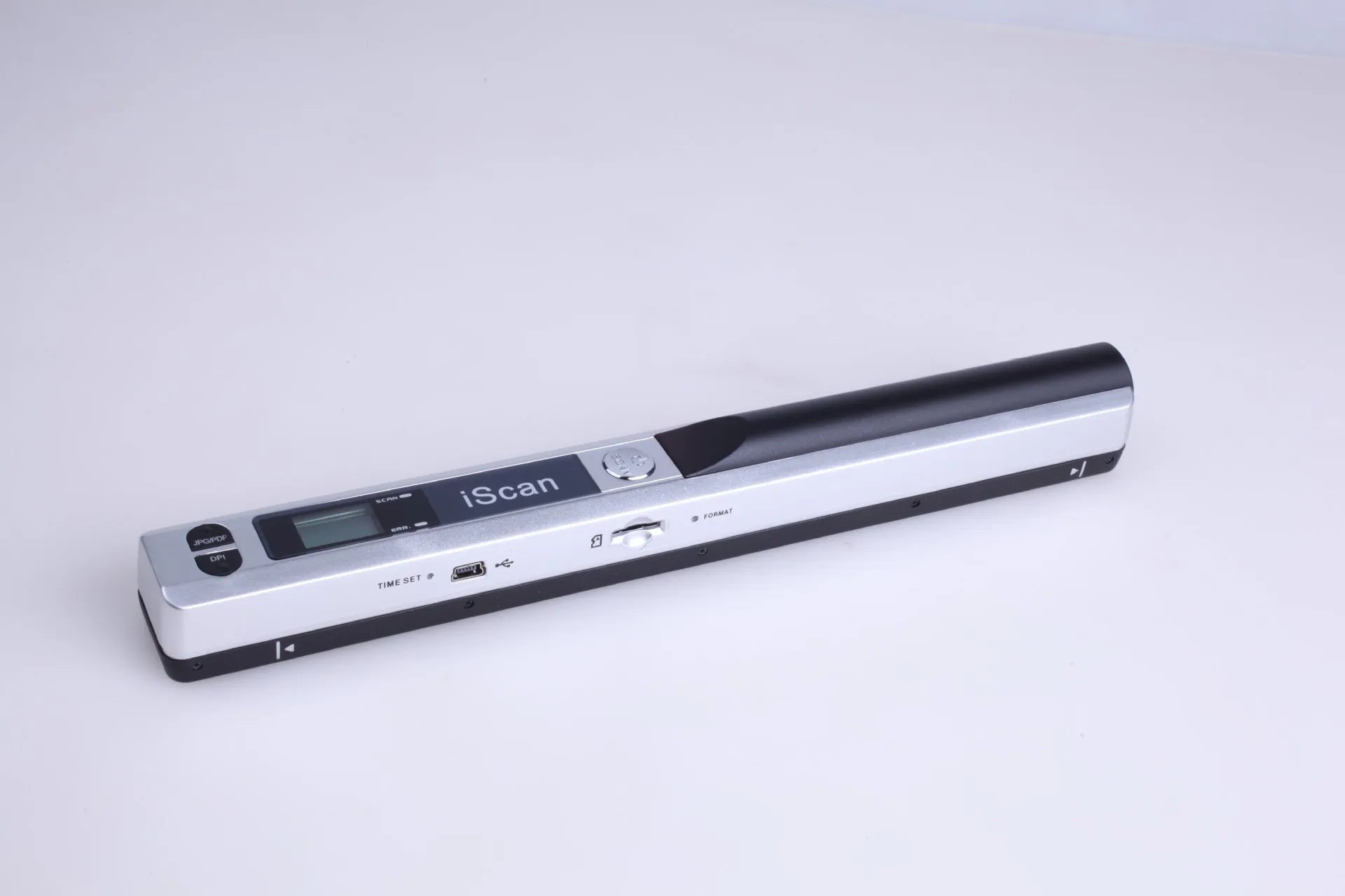 Plastic handheld USB document scanner on a desk next to papers.