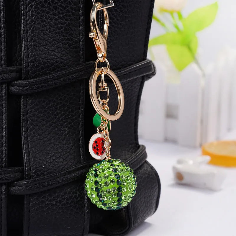 Green watermelon-shaped zinc alloy keychain measuring 12cm