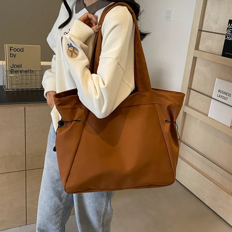 Soft foldable Oxford cloth commuter shoulder tote bag in street trend style.