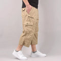 Man wearing loose-fitting khaki cotton cropped casual pants for sports.