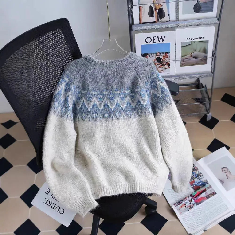Women's loose-fit jacquard knit sweater coat in milky white, shown with long sleeves and textured pattern.