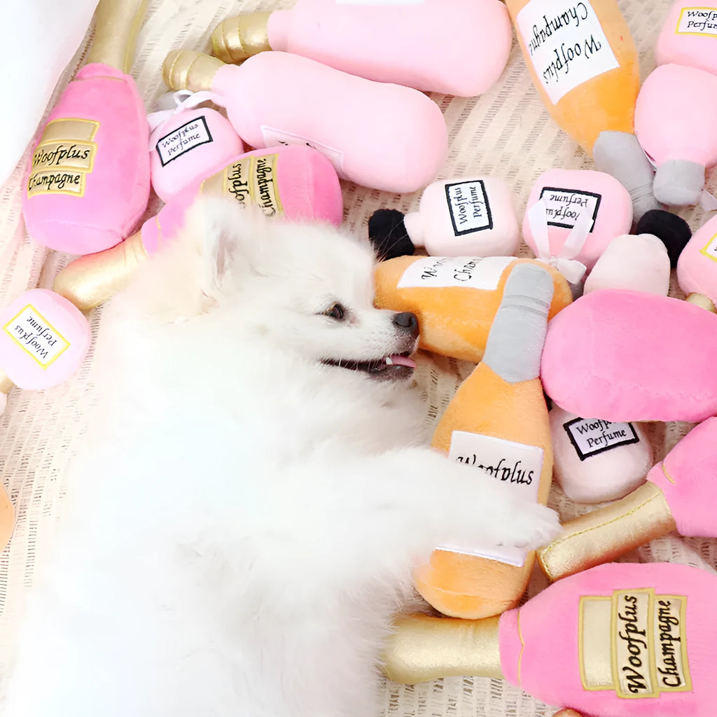 Plush wine bottle shaped pet toy for dogs and cats in assorted colours.