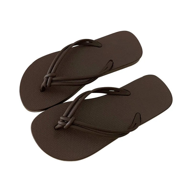 Women's pink flip flops with toe-covering design and non-slip PVC sole for summer outdoor wear