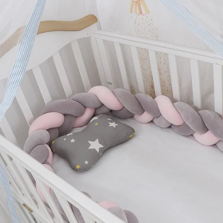 Braided knot cot bumper cushion in spandex velvet for crib safety protection.