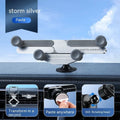Silver invisible alloy car phone holder mounted on vehicle air outlet with mobile phone in position