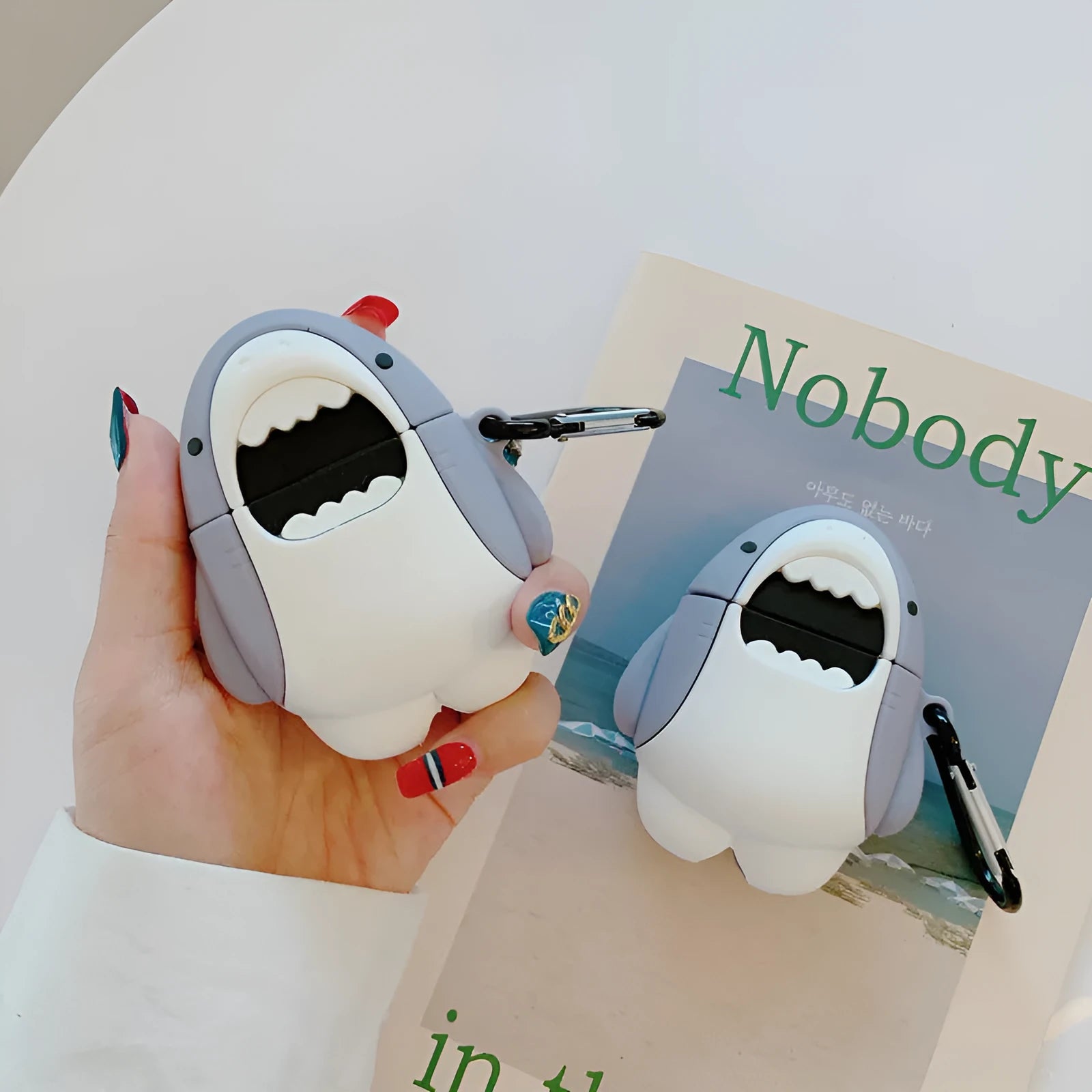Silicone protective case for Apple AirPods 1 and 2 with a shark fin design.