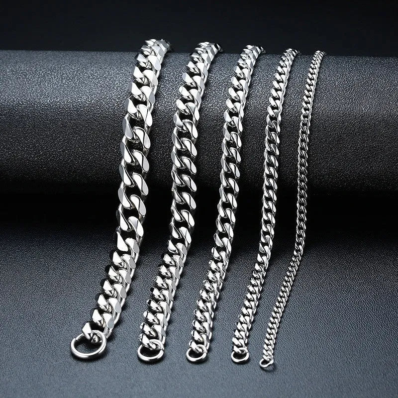 Geometric six-sided Cuban link metal bracelet shown in gold, black and steel colour finishes with varying widths from 3mm to 11mm.