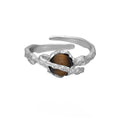 Adjustable opening women's ring with Saturn design in white gold colour electroplated silver