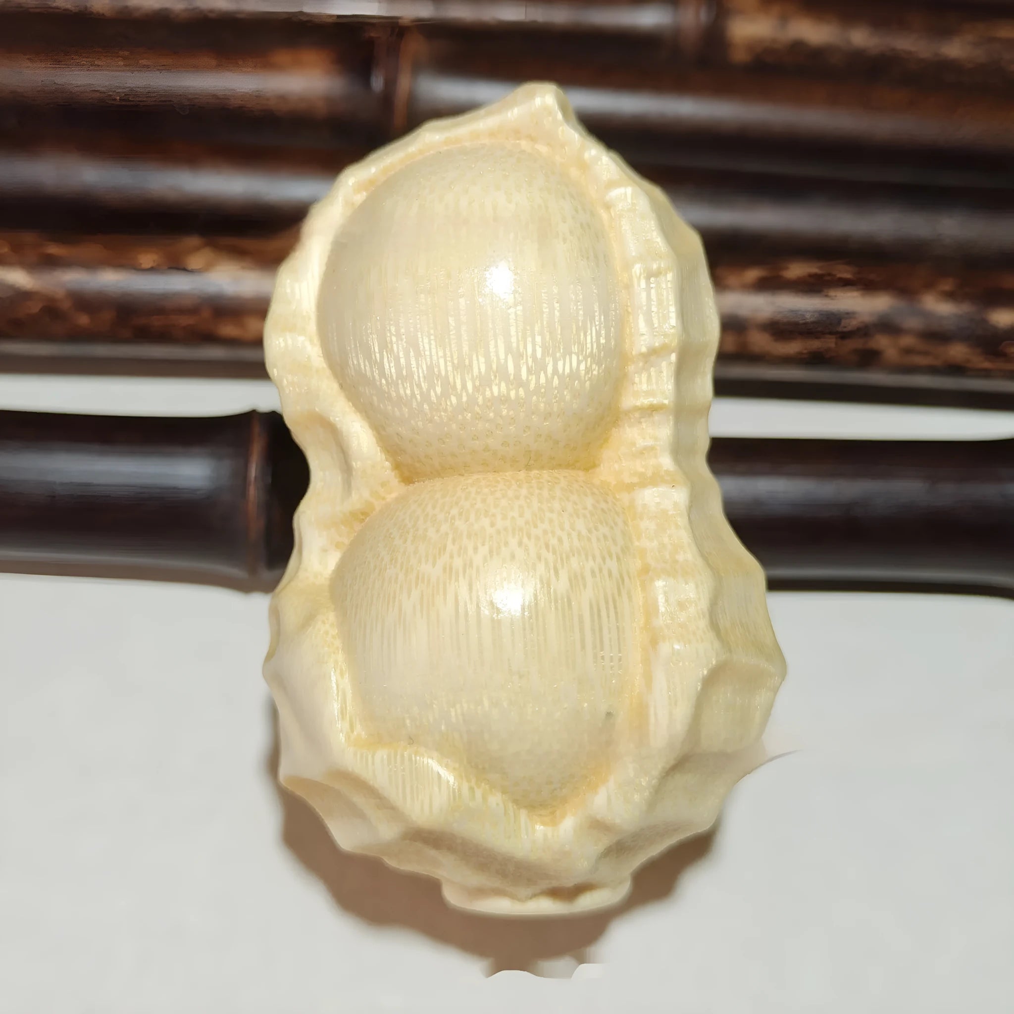 Solid bamboo carving peanut ornament with modern simplicity style and 'May Good Things Happen' message