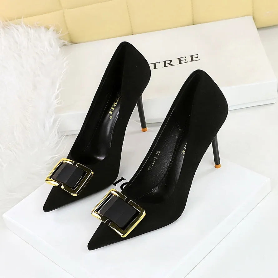 Black suede women's stiletto high heels with 9cm heel and pointed toe on a plain background.