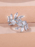 Adjustable opening copper leaf fashion ring with sparkling zirconia stones in a rose gold finish.