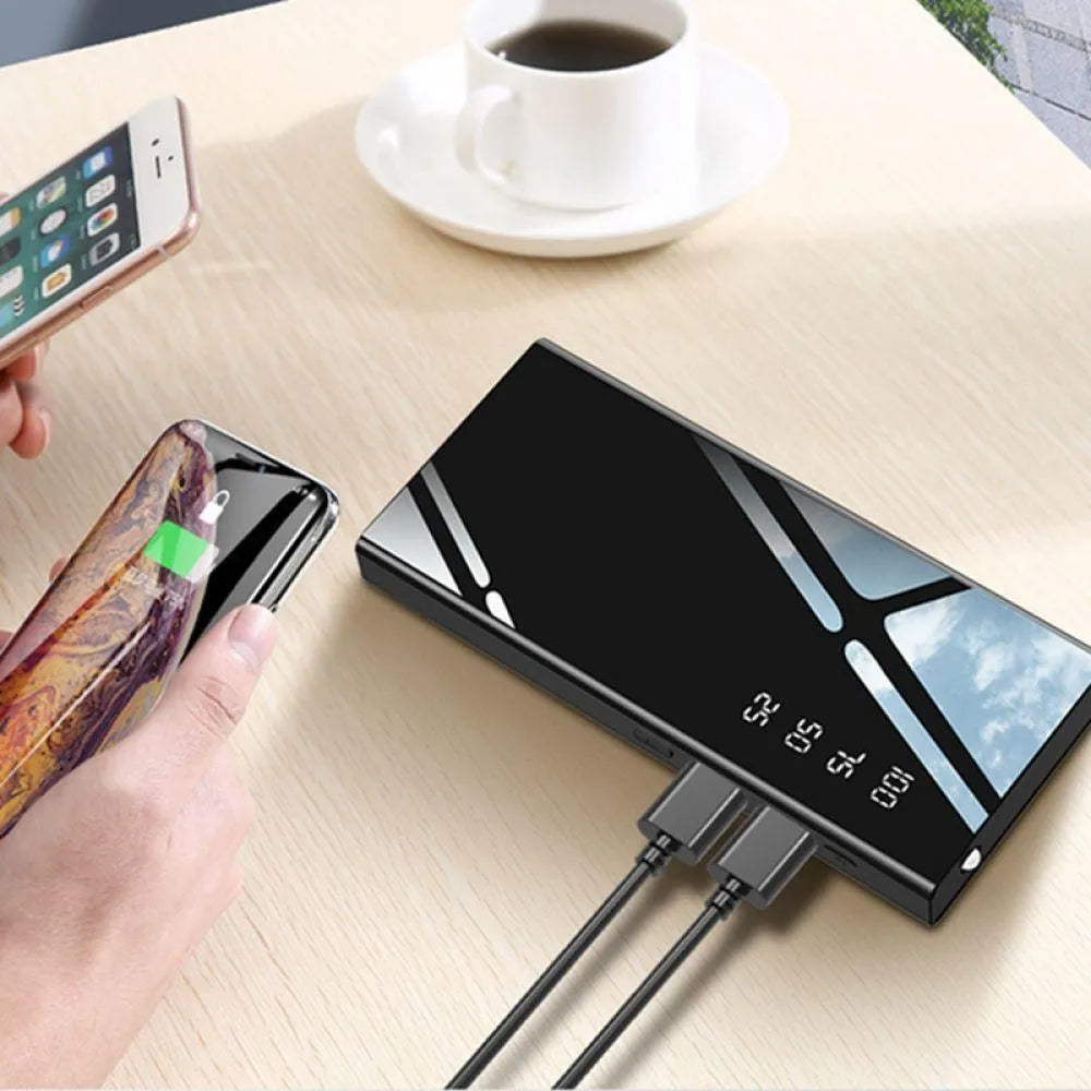 Black 20000mAh power bank with LCD display screen and dual USB ports.