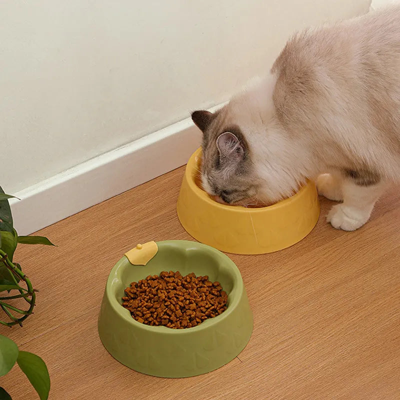 Green plastic double bowl for dog and cat food and water with anti-tip base.