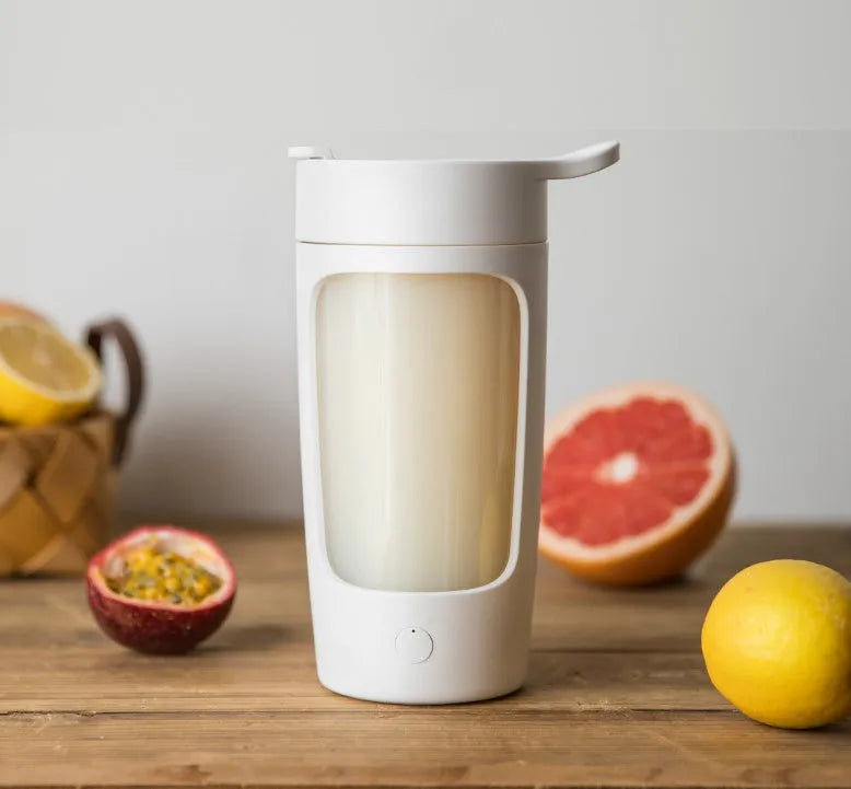 Portable personal blender in black, blue, pink or white colours showing 650ml cup with integrated blades