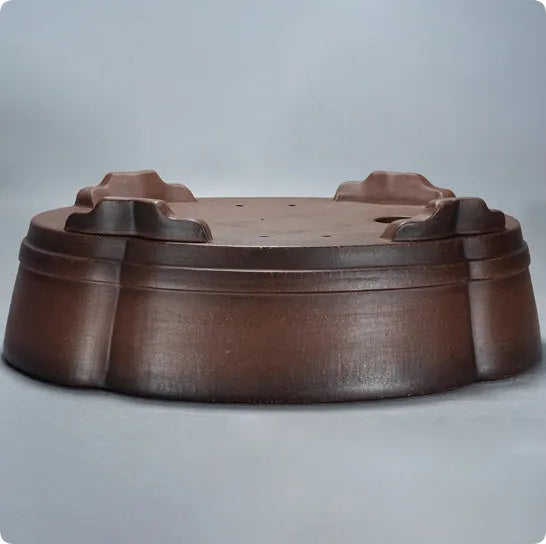 A classical style purple clay bonsai flower pot with simple design.