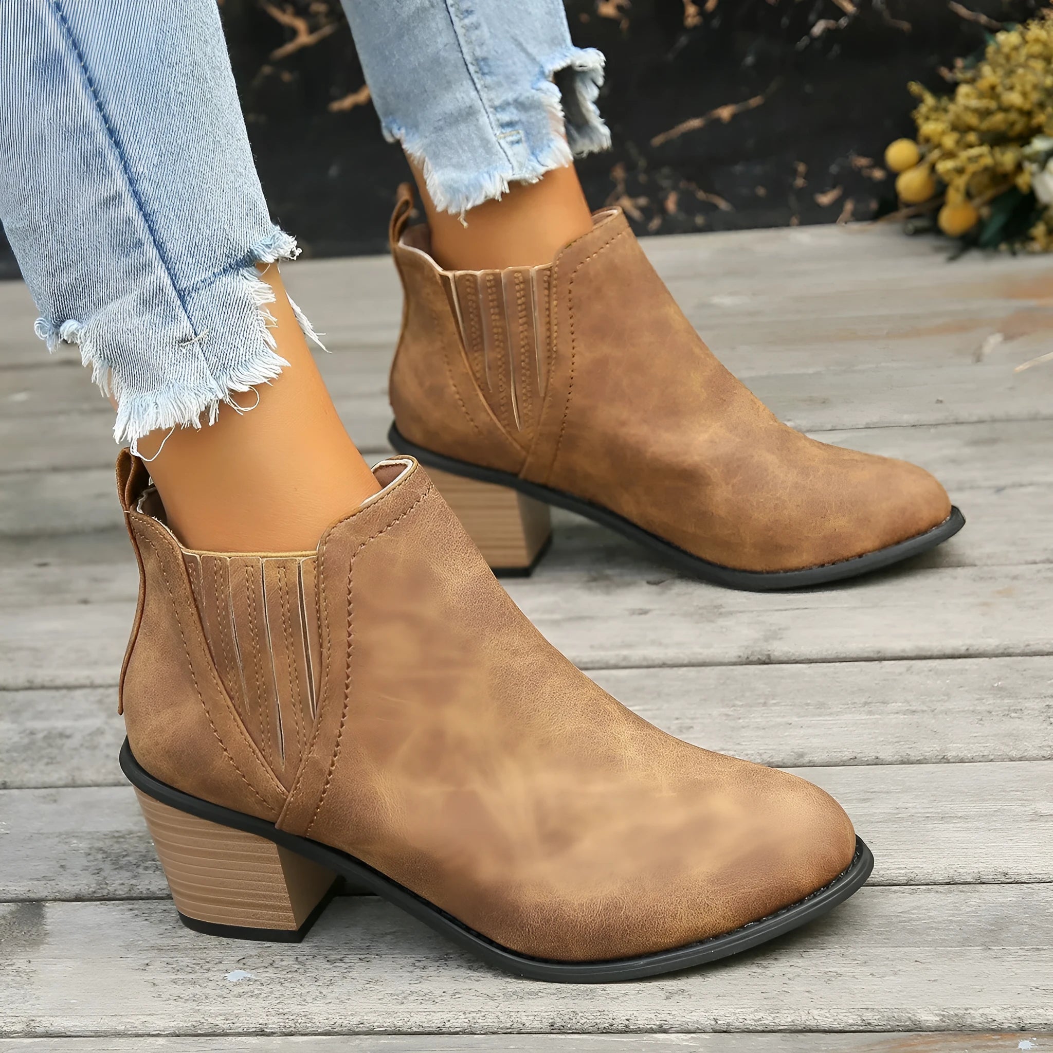 Women's black pointed toe ankle boots with thick square heel and slip-on design