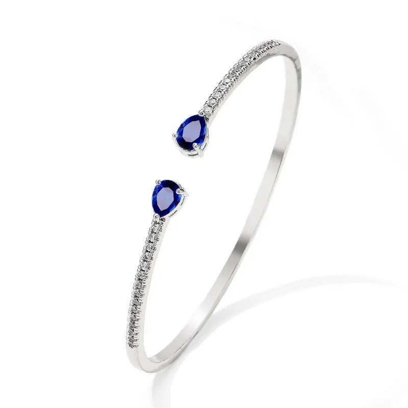 Copper bracelet with multi-zircon inlay stones in simple style, shown in white and blue colour options