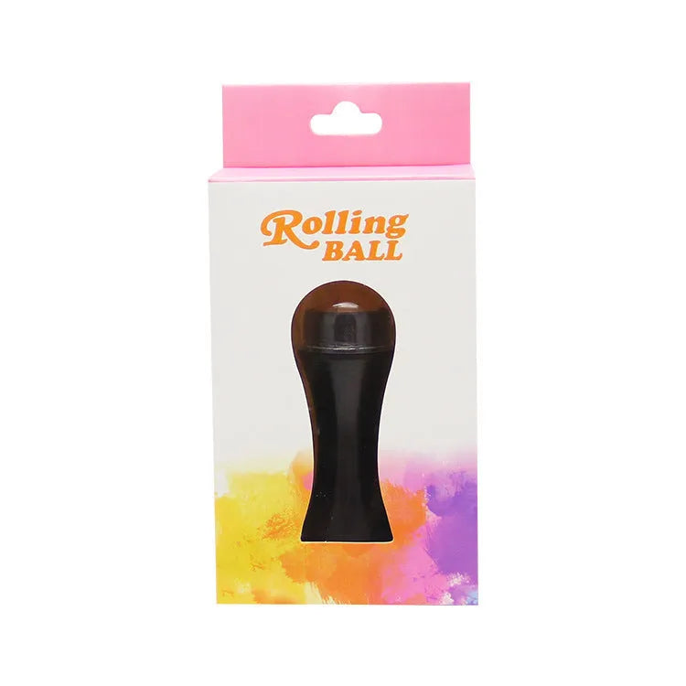 Portable volcanic stone oil-absorbing facial roller in black, green, pink, or white on a plain background.