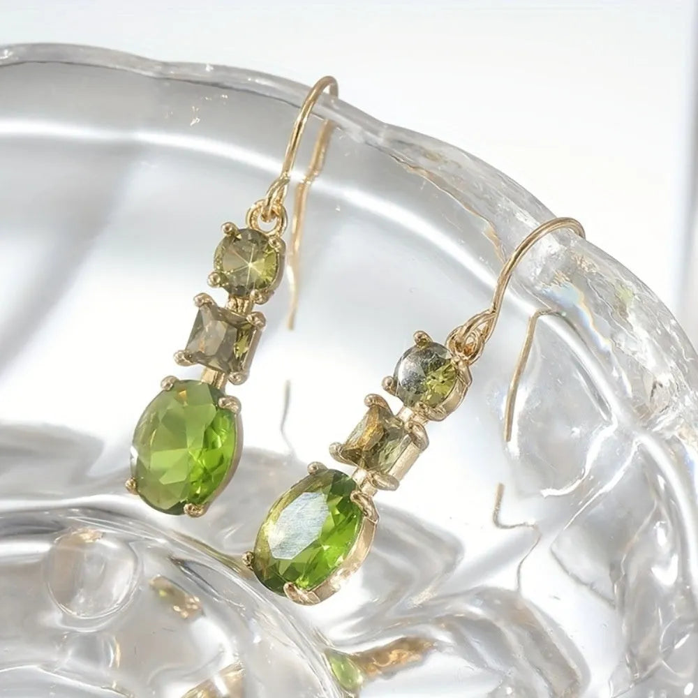 Green geometric quadrilateral copper earrings in a retro Bohemian unisex style.