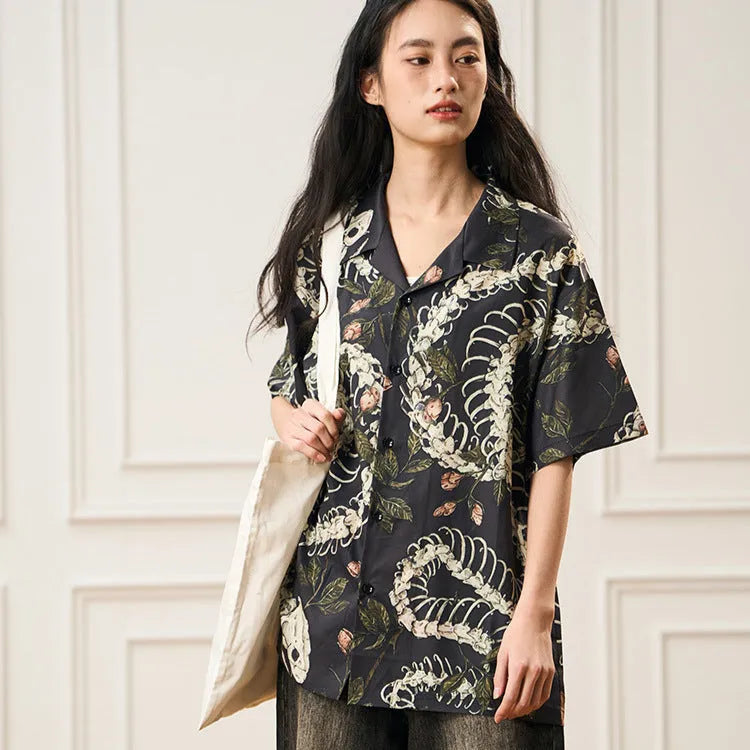 Short sleeve Cuban collar shirt with snake bone and floral pattern print in a loose fit.