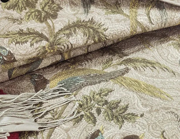 Blue American flower and bird pattern quilted cotton bedspread set on a bed