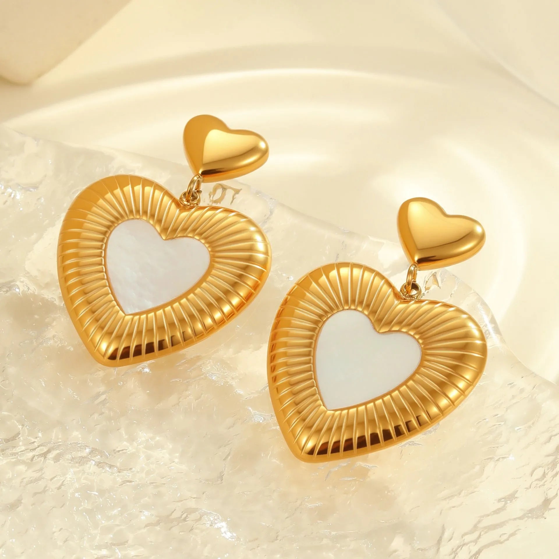 Gold electroplated heart-shaped stainless steel earrings with 18K purity and love element design