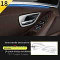 Set of four silver and black decorative trim strips for BMW 5 Series interior door handles.