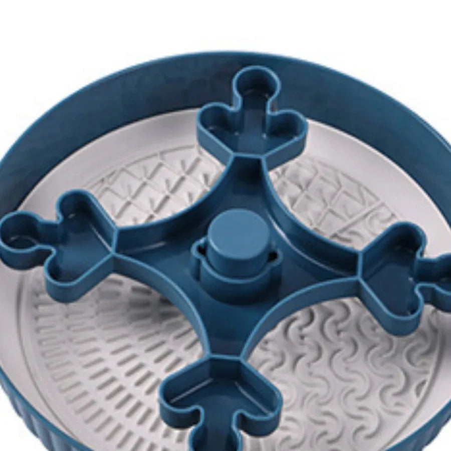 Interactive dog slow feeder bowl with rotating game board and textured silicone licking mat insert.