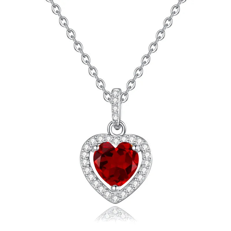 Sterling silver heart pendant necklace with a choice of coloured gemstones on a cross chain.