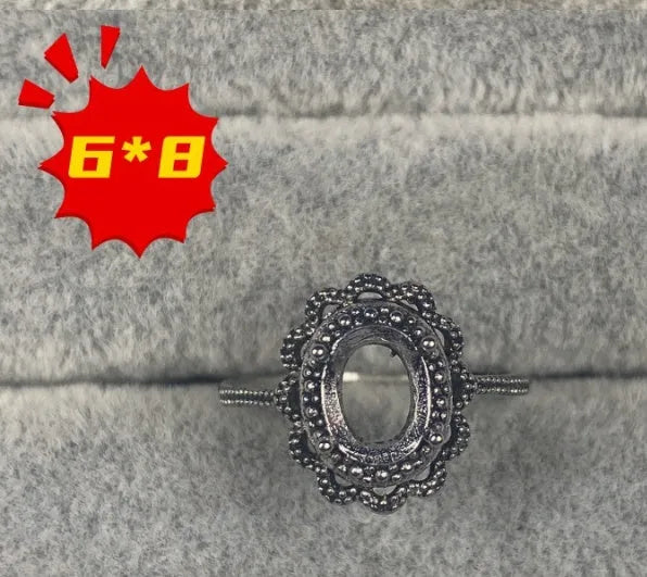 Oval denier ring with 6x8mm stone, open mouth design, and five-pointed star detail
