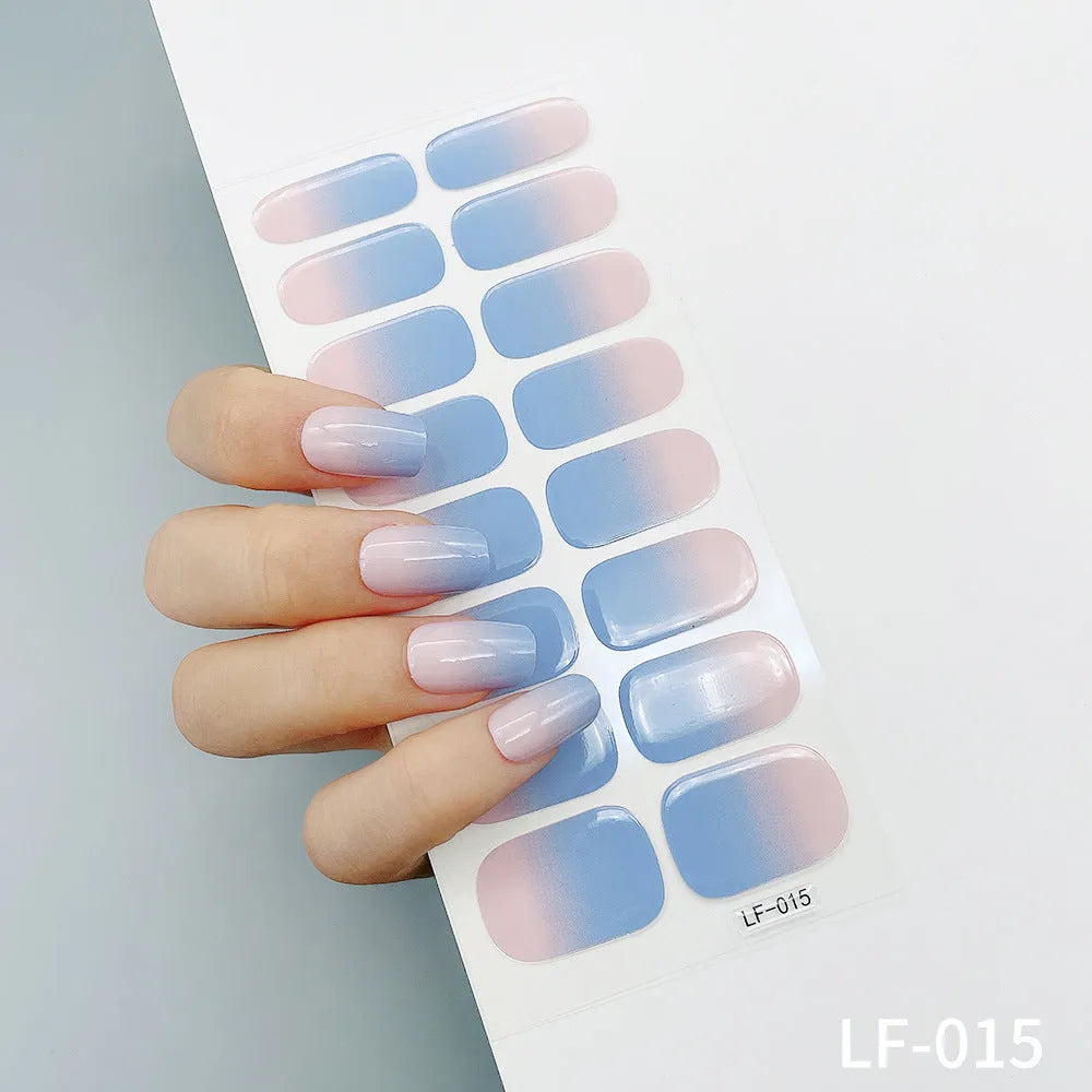 Full coverage nail art stickers sheet with 16 designs including cross, rose, tulip, and cartoon patterns.
