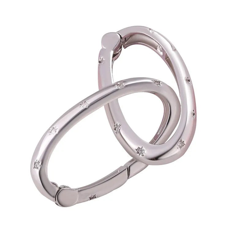 Copper climbing buckle with electroplated gold finish, showing multiple design options