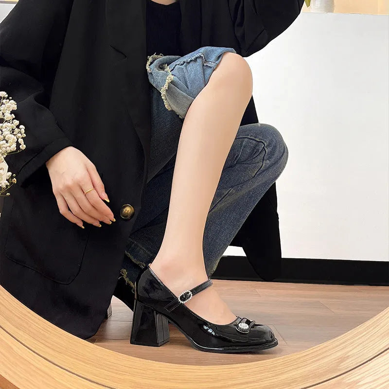 Women's black patent leather chunky heel high heels with round toe and buckle fastening