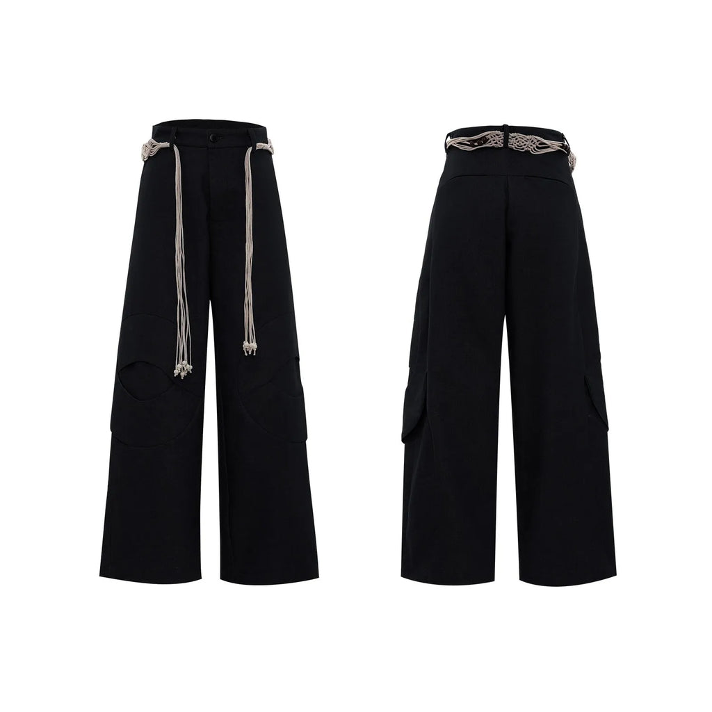 Men's dark blue loose-fit straight-leg cotton trousers with zipper decoration and tassel detail.