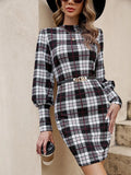 Black tight dress with lantern sleeves and leather stitch detailing, mid-length skirt