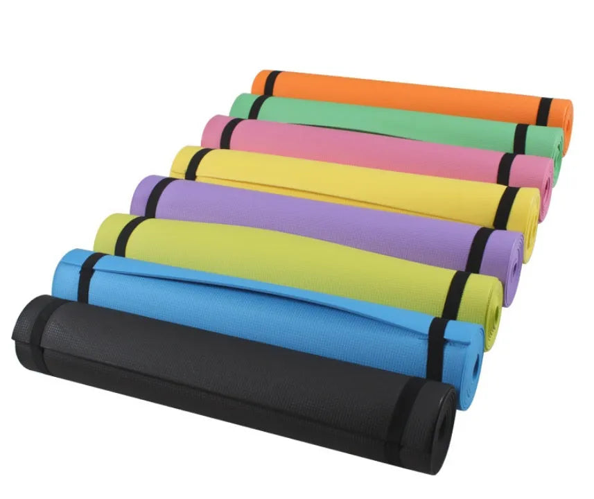 Red EVA fitness yoga mat showing texture and thickness, rolled partially with carry bag.