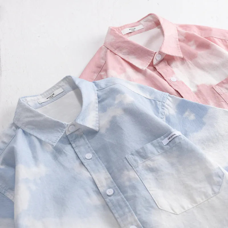 Men's light pink pure cotton loose short-sleeved cardigan-style shirt on a hanger.