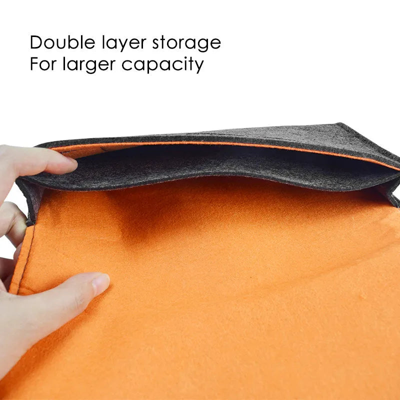 Black felt Nintendo Switch carrying pouch with game card slots and double compartments.