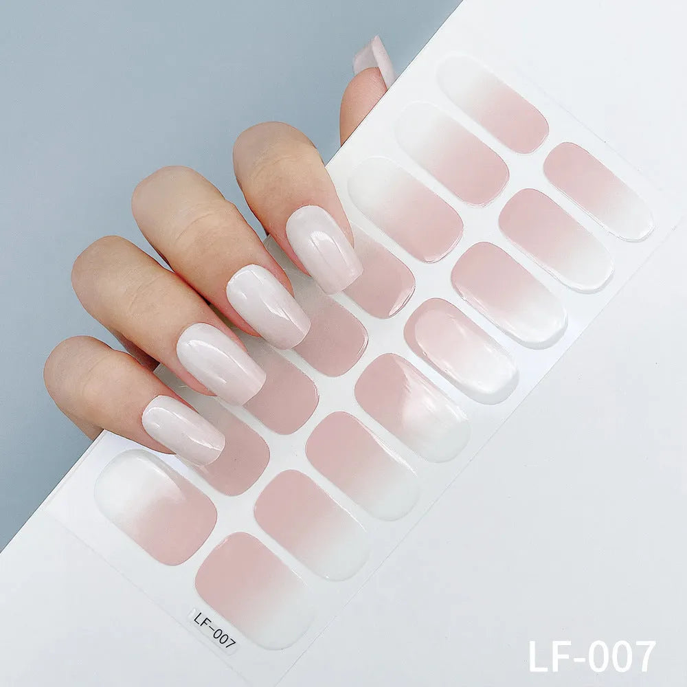 Full coverage nail art stickers sheet with 16 designs including cross, rose, tulip, and cartoon patterns.
