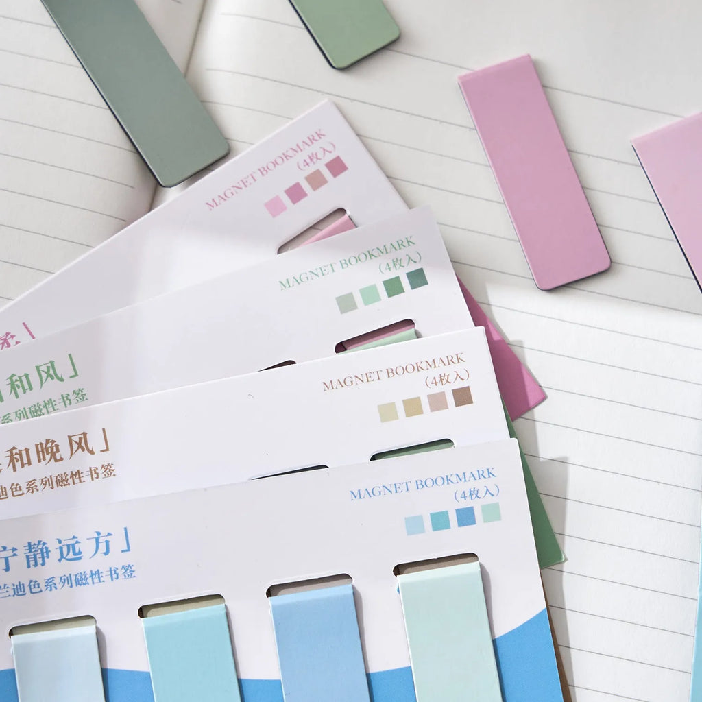 Set of four miniature magnetic bookmarks in Morandi colour block designs: soft blue, grey-green, dusty pink, and mauve.