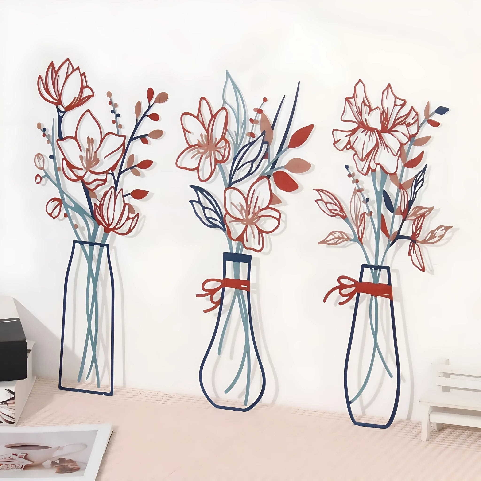 Set of three metal flower vase wall decorations in modern farmhouse style.