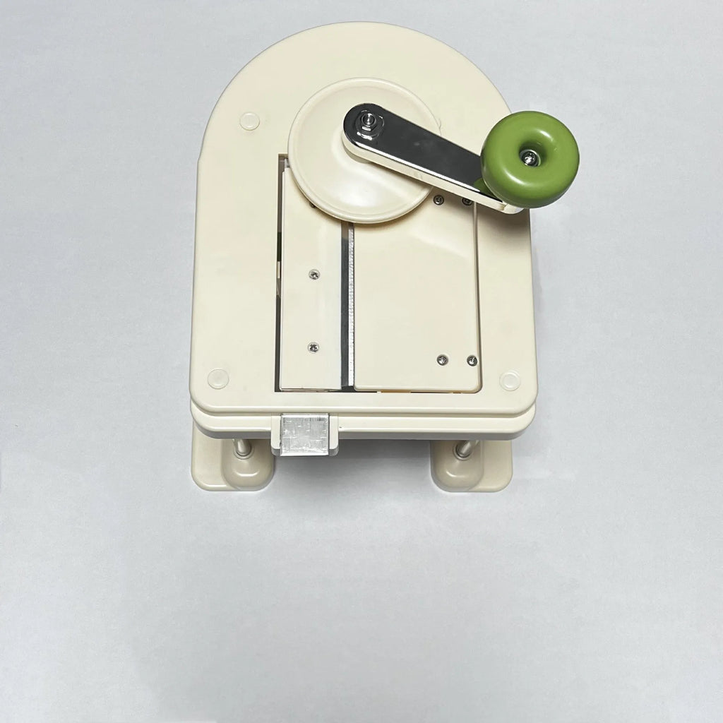 Beige vegetable slicer chopper with stainless steel blades for shredded potatoes and spiral vegetables