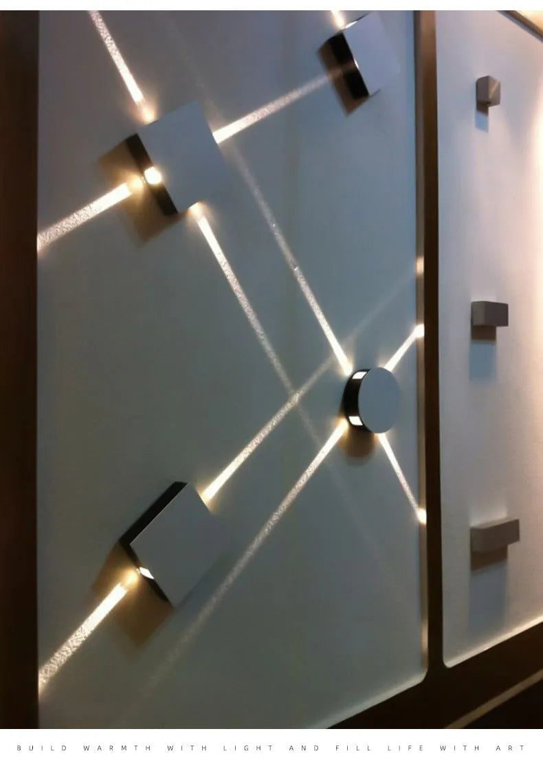 Modern square and round aluminium LED wall light with iron shade in warm white or white.
