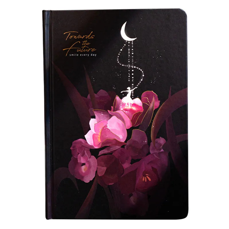 A5 notebook with luminous cover showing colour illustration interior pages and dot grid layout