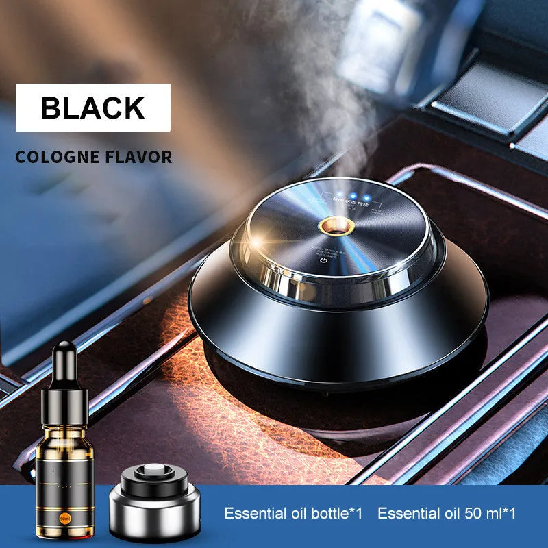 Black metal butterfly-shaped car aromatherapy diffuser with USB cable and 50ml essential oil bottle.