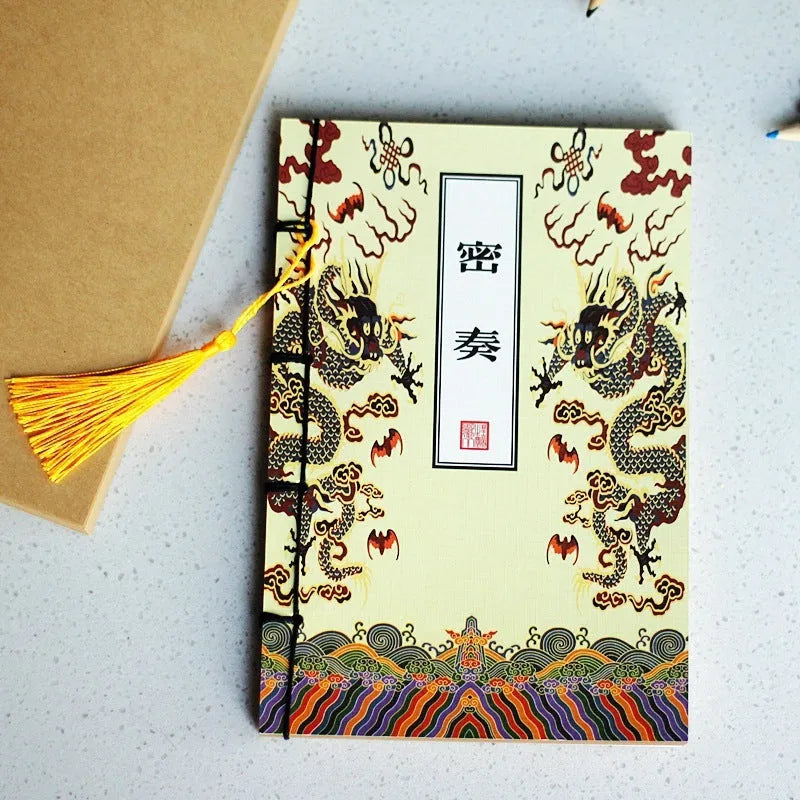 A5 antique wire-bound notebook with retro painting cover, thread binding, and black tassels.